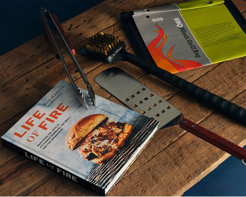 Grilling tools and a cookbook.