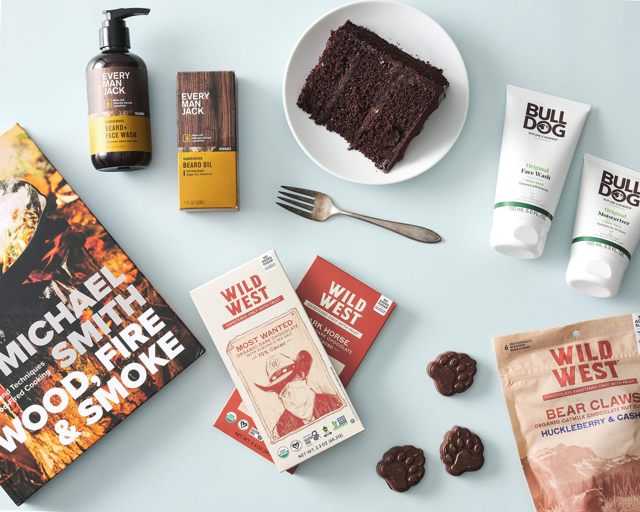A book, chocolate, facial care products, and chocolate cake