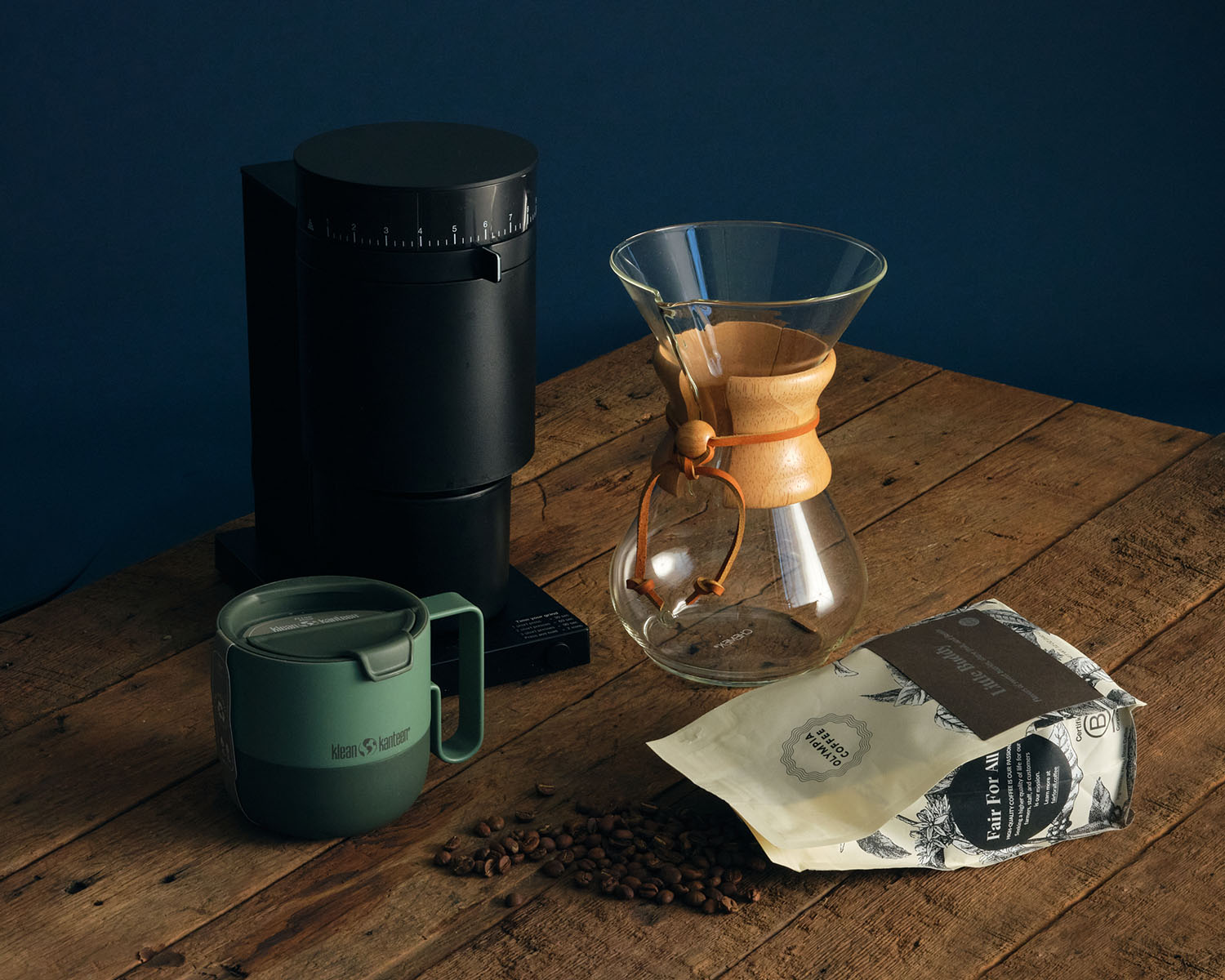 Coffee accessories including a carafe, mug, and coffee grinder.