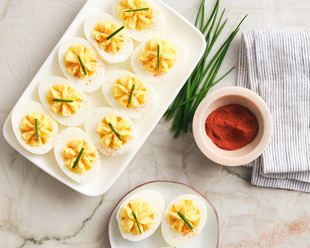 Deviled eggs with chives and paprika