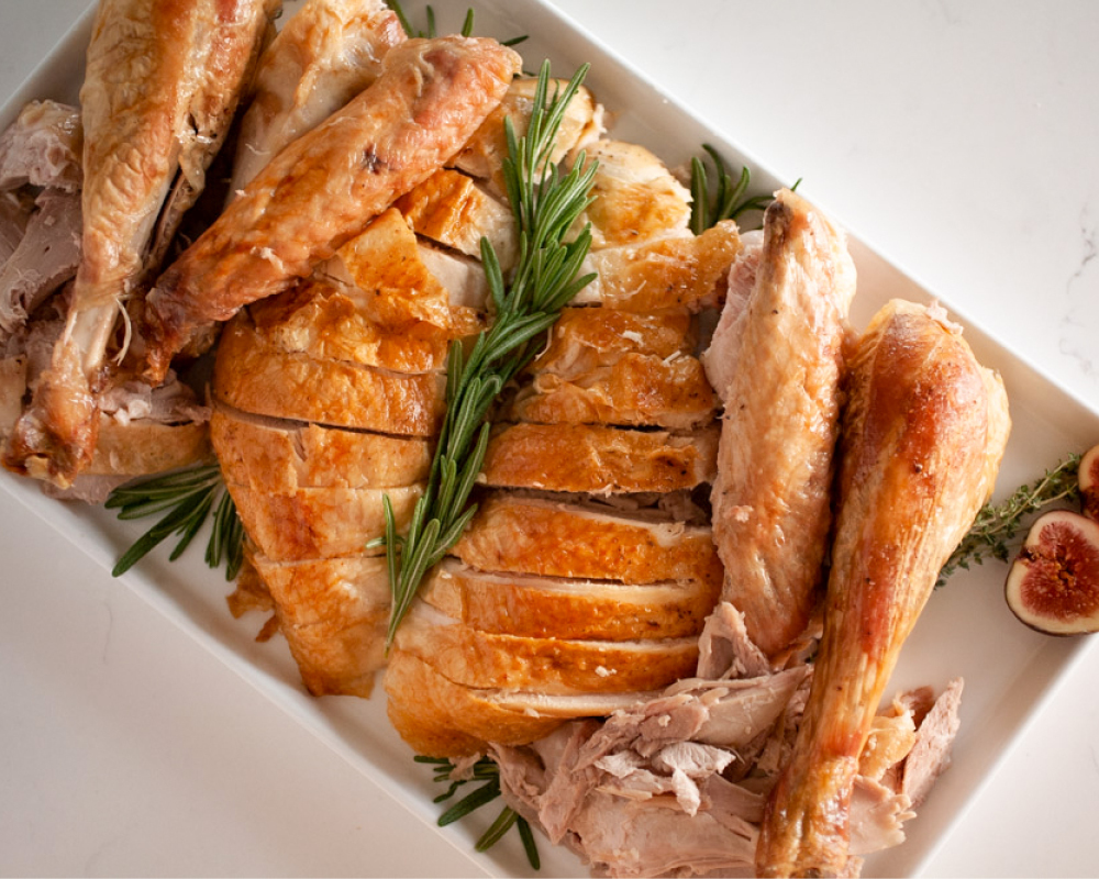 Carved turkey with rosemary sprigs