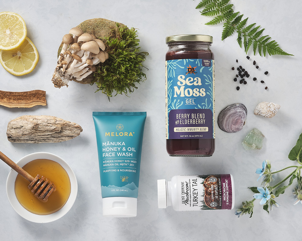 Natural elements and products scattered on a gray white background