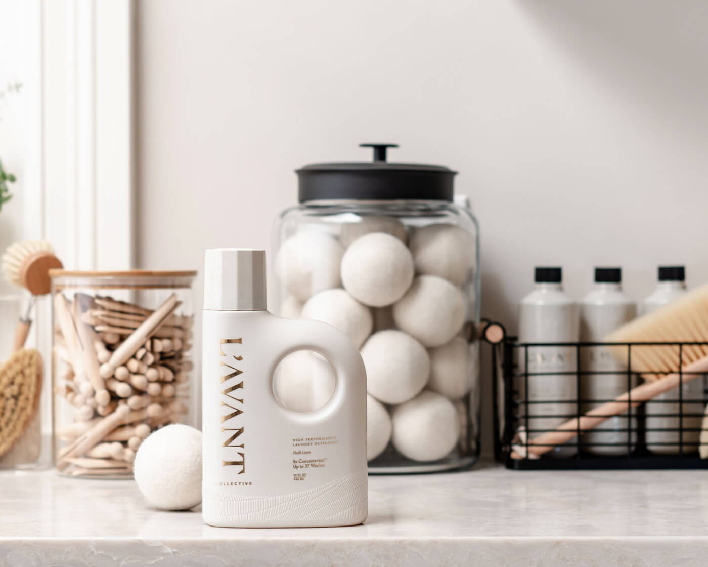L'Avant Collective product with jar of balls and wooden sticks