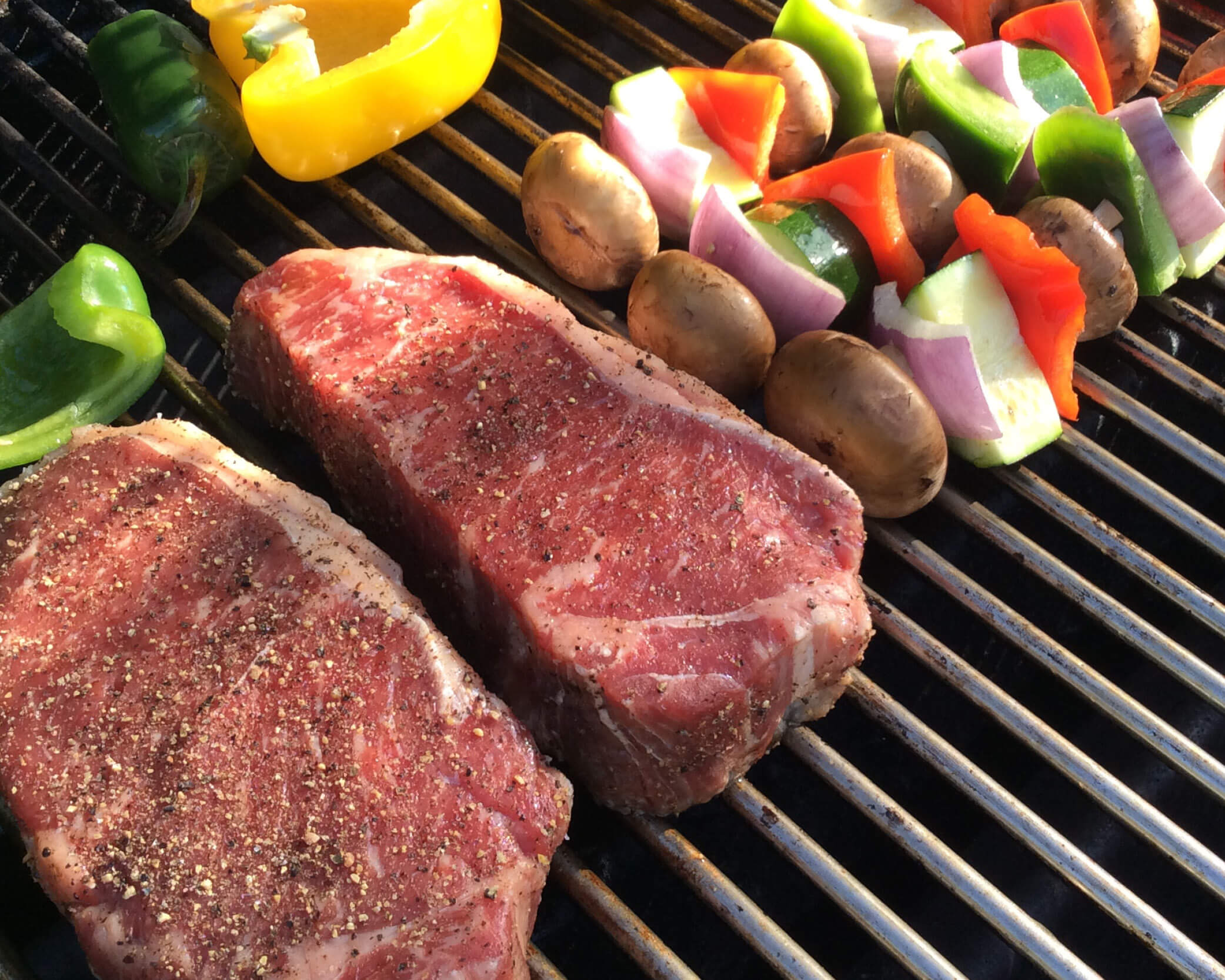 grilling steak and vegetables