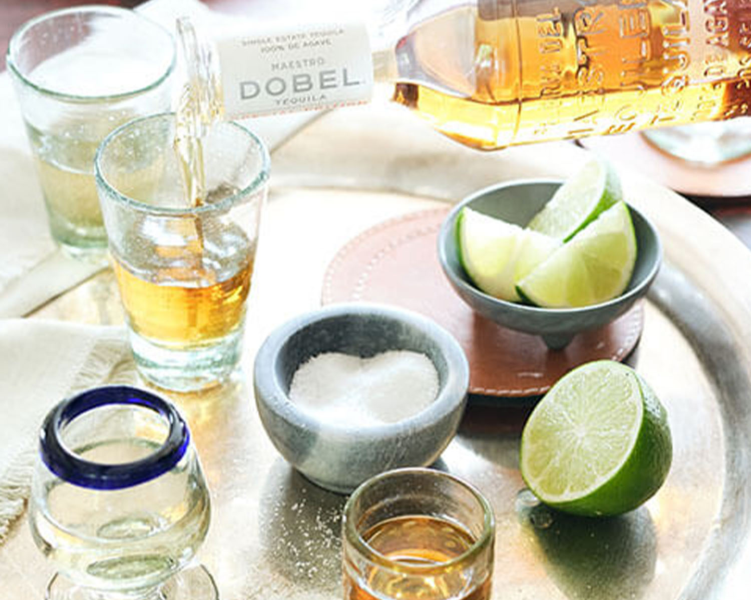 tequila shot glasses limes and salt