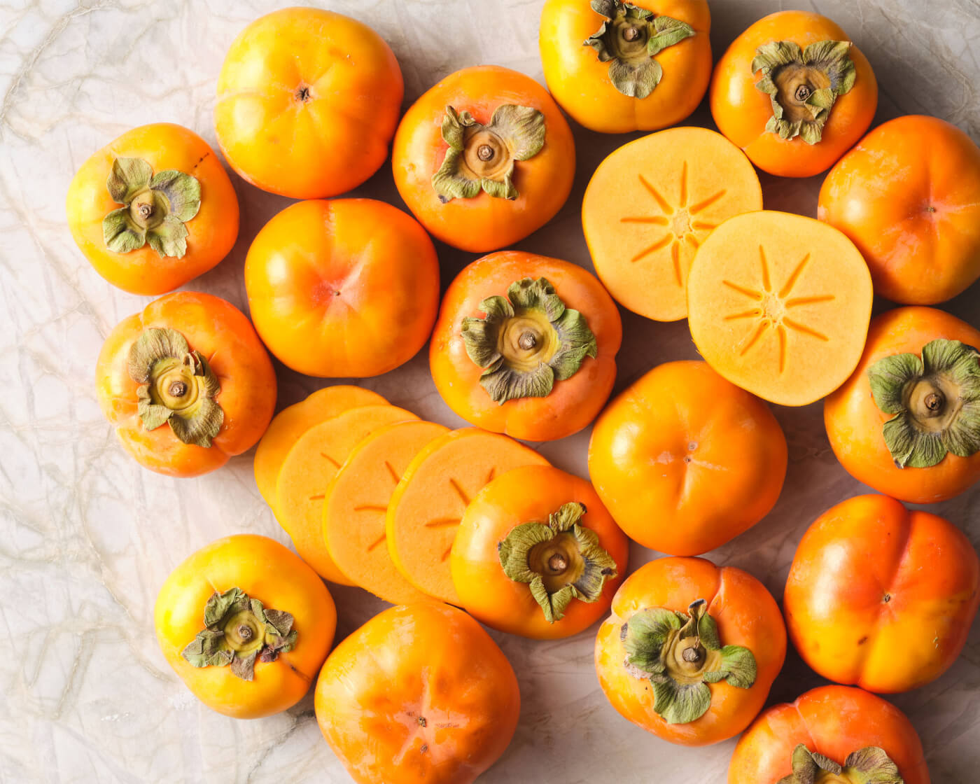 persimmons on white background