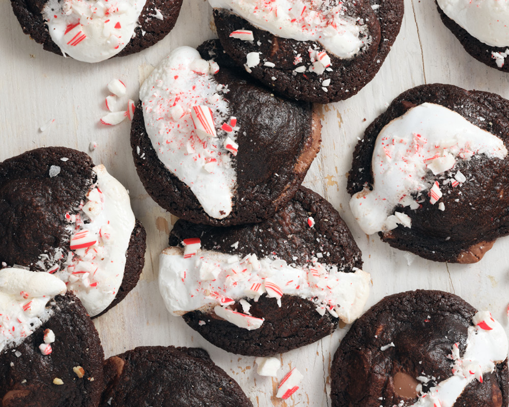 Peppermint Cocoa Cookies on a white table with crushed candy canes