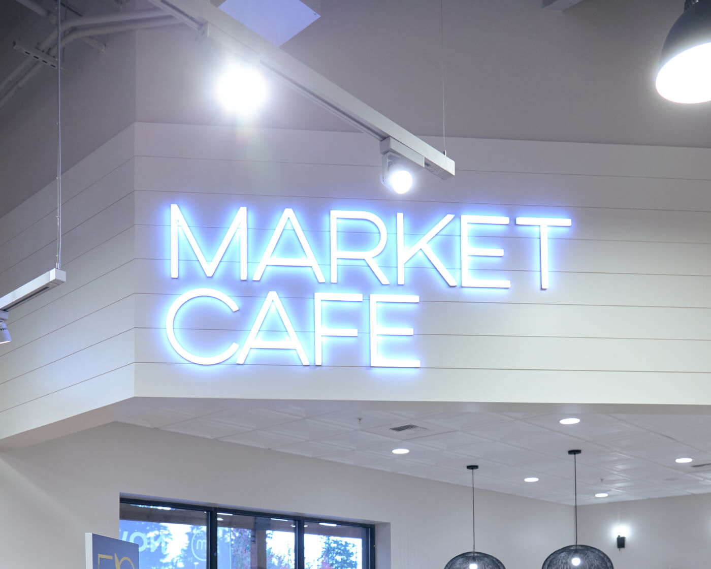 glowing market cafe sign