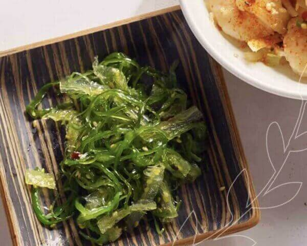 Plate of green onion salad.