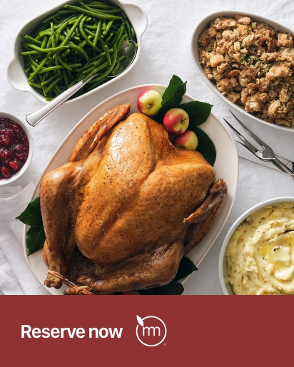 turkey, green beans, stuffing, mashed potatoes, and cranberry sauce on a table