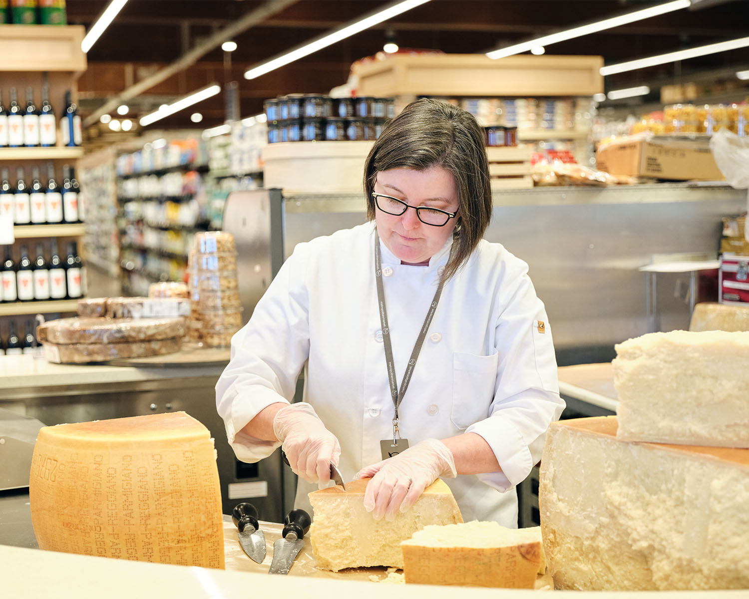 Kim Martin cutting parmesan cheese