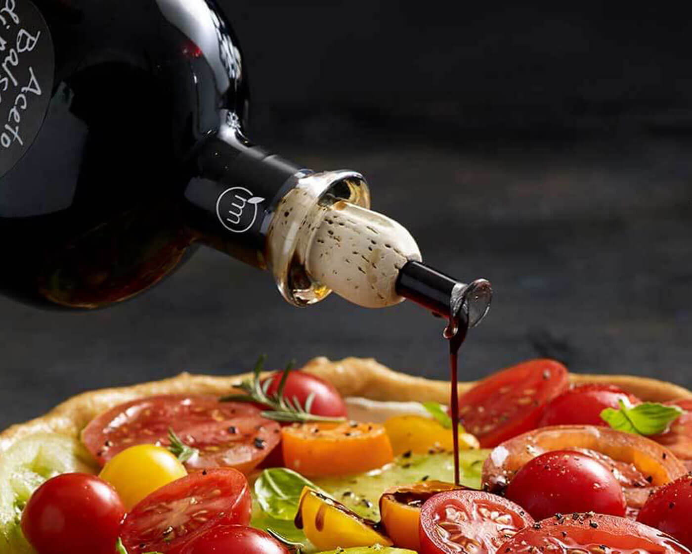 Balsamic vinegar drizzled on a tomato tart