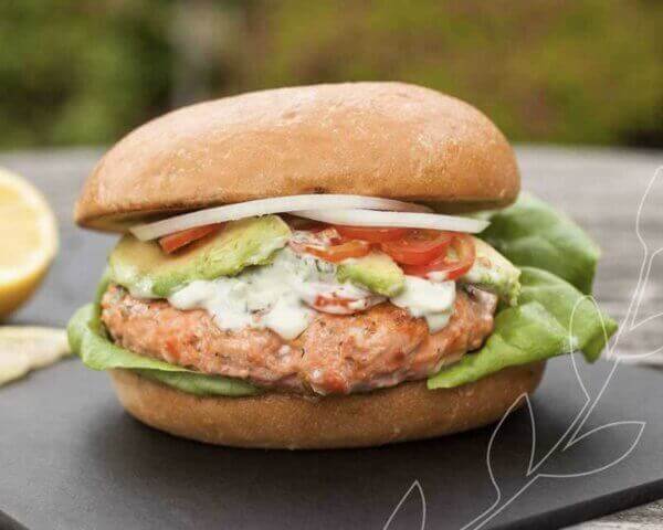 Crab cake burger on a slate tray.