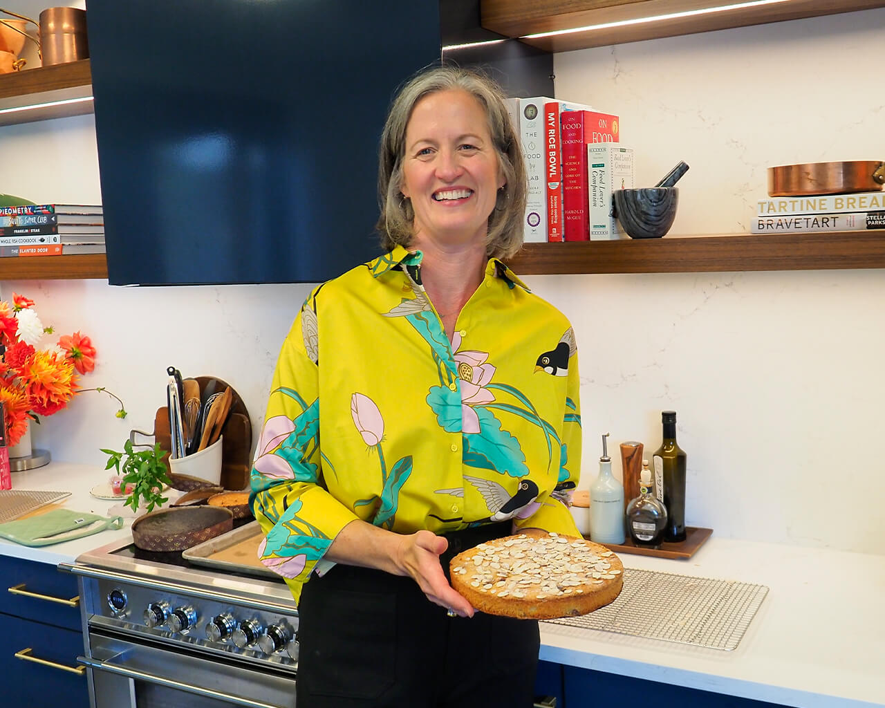 Lindsay Gott holding an almond cake