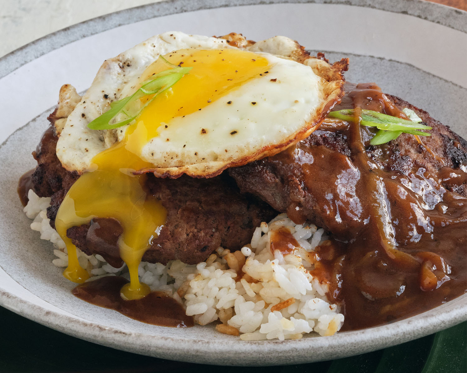 loco moco with a runny fried egg and gravy