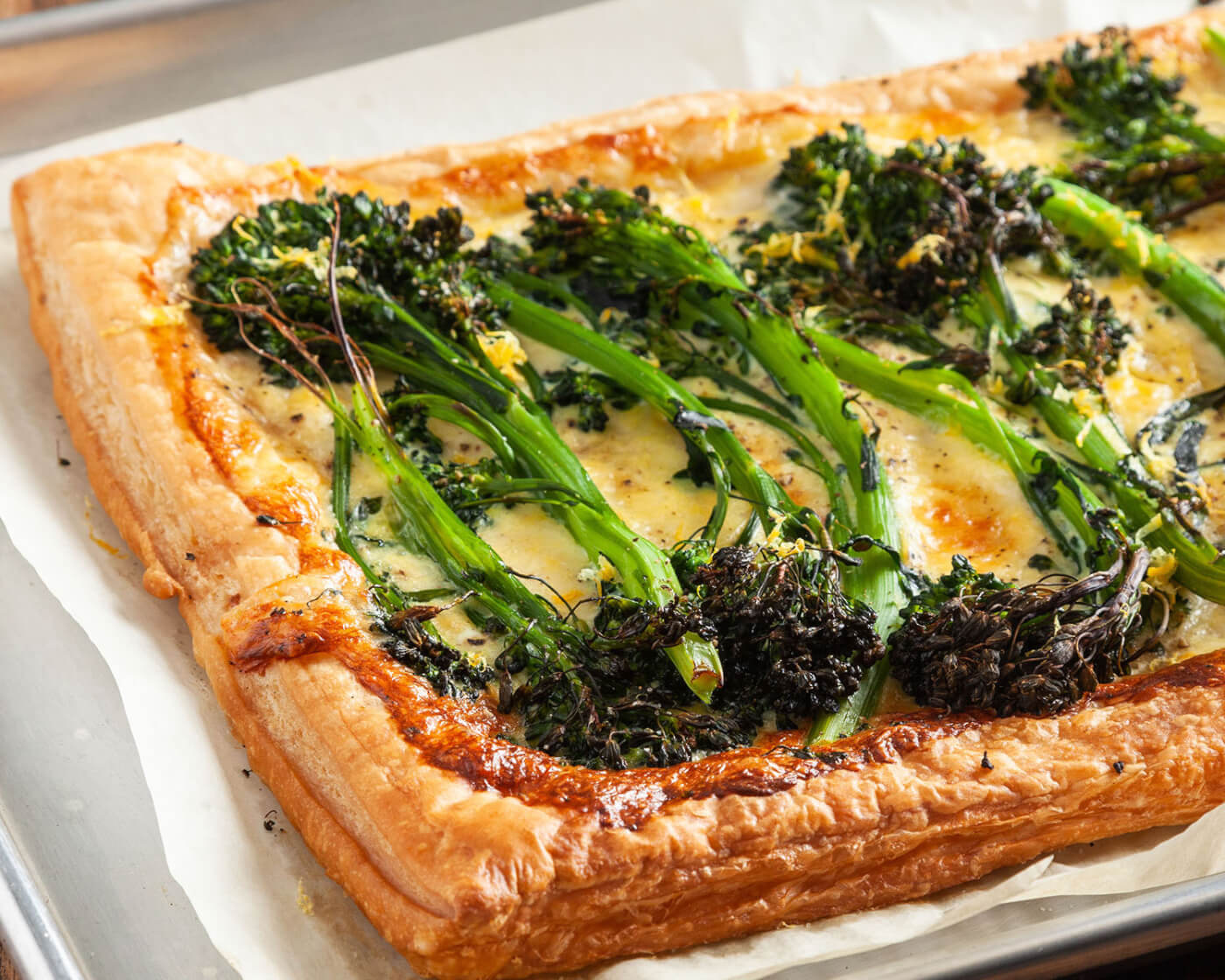 Broccolini on a flaky pastry crust.