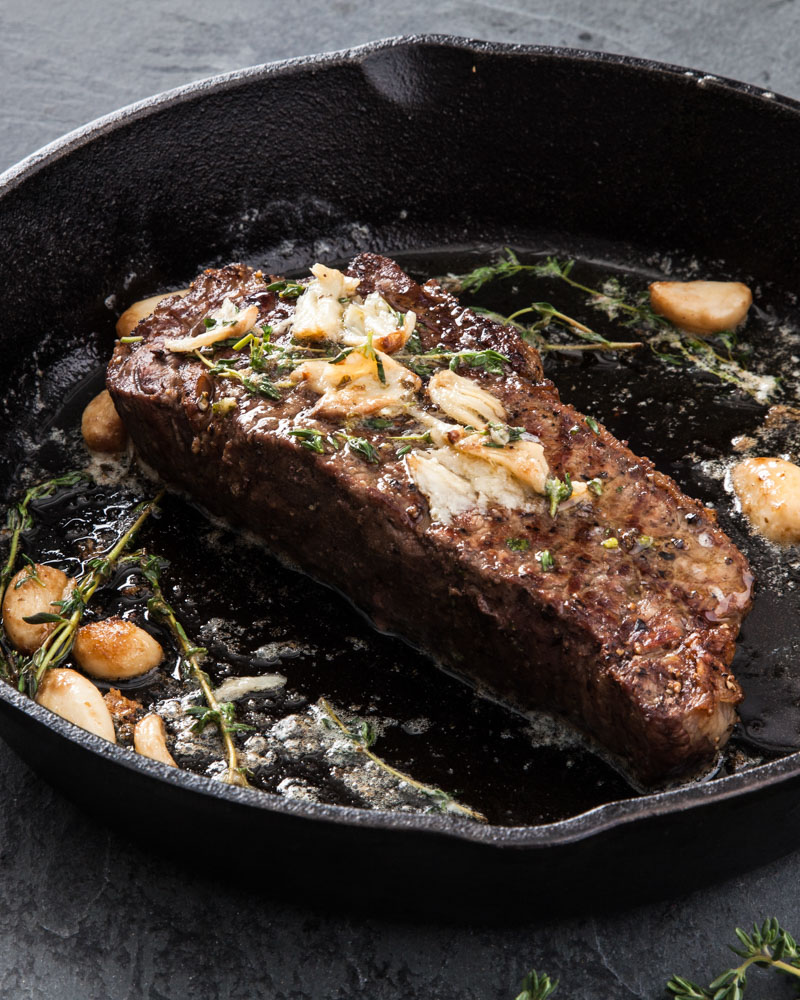 Pan-Fried New York Beef Steak with Garlic and Herbs