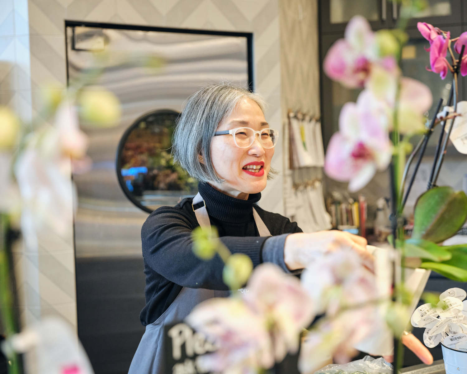 Yumi Han holding an orchid