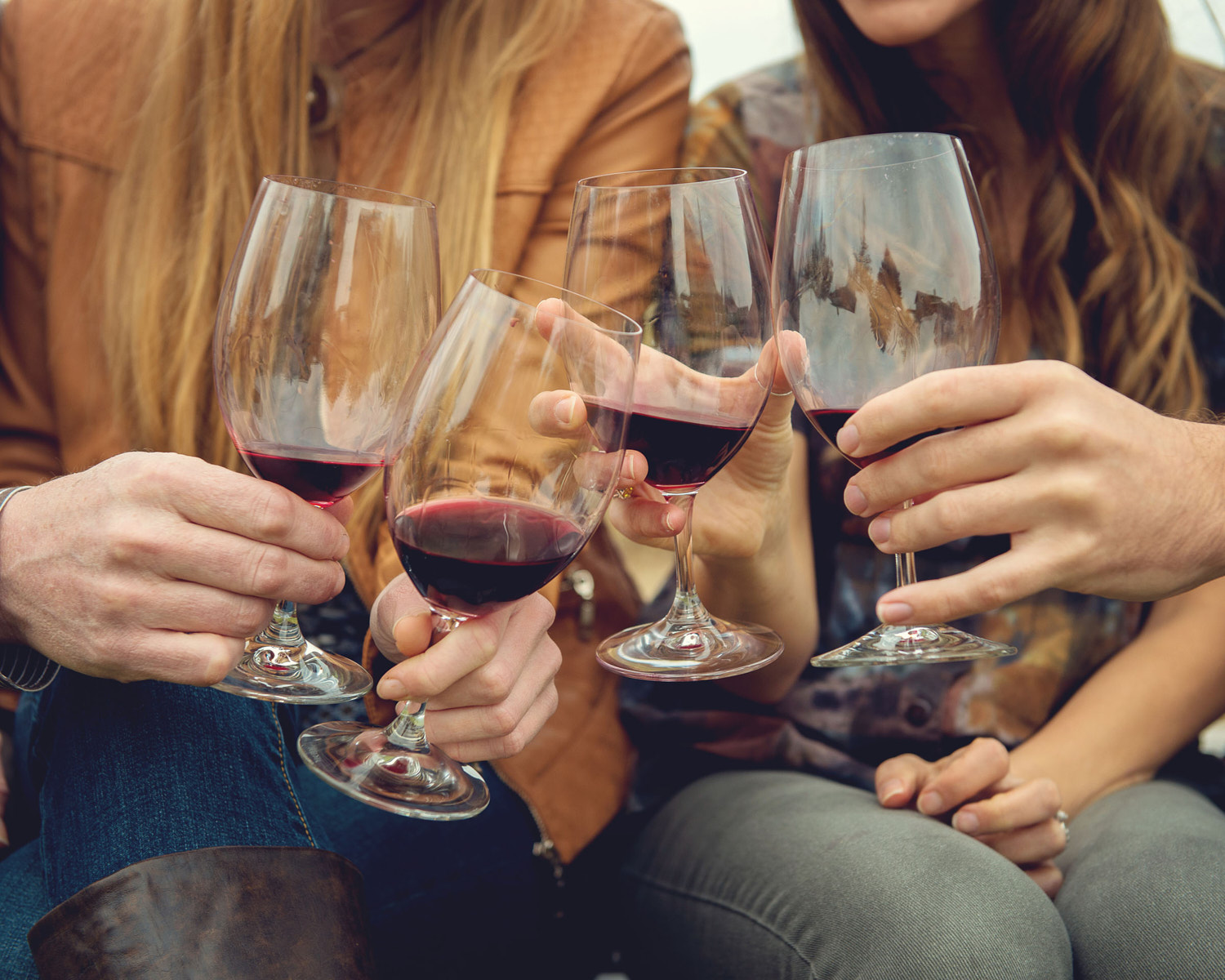 group toasting with wine glasses