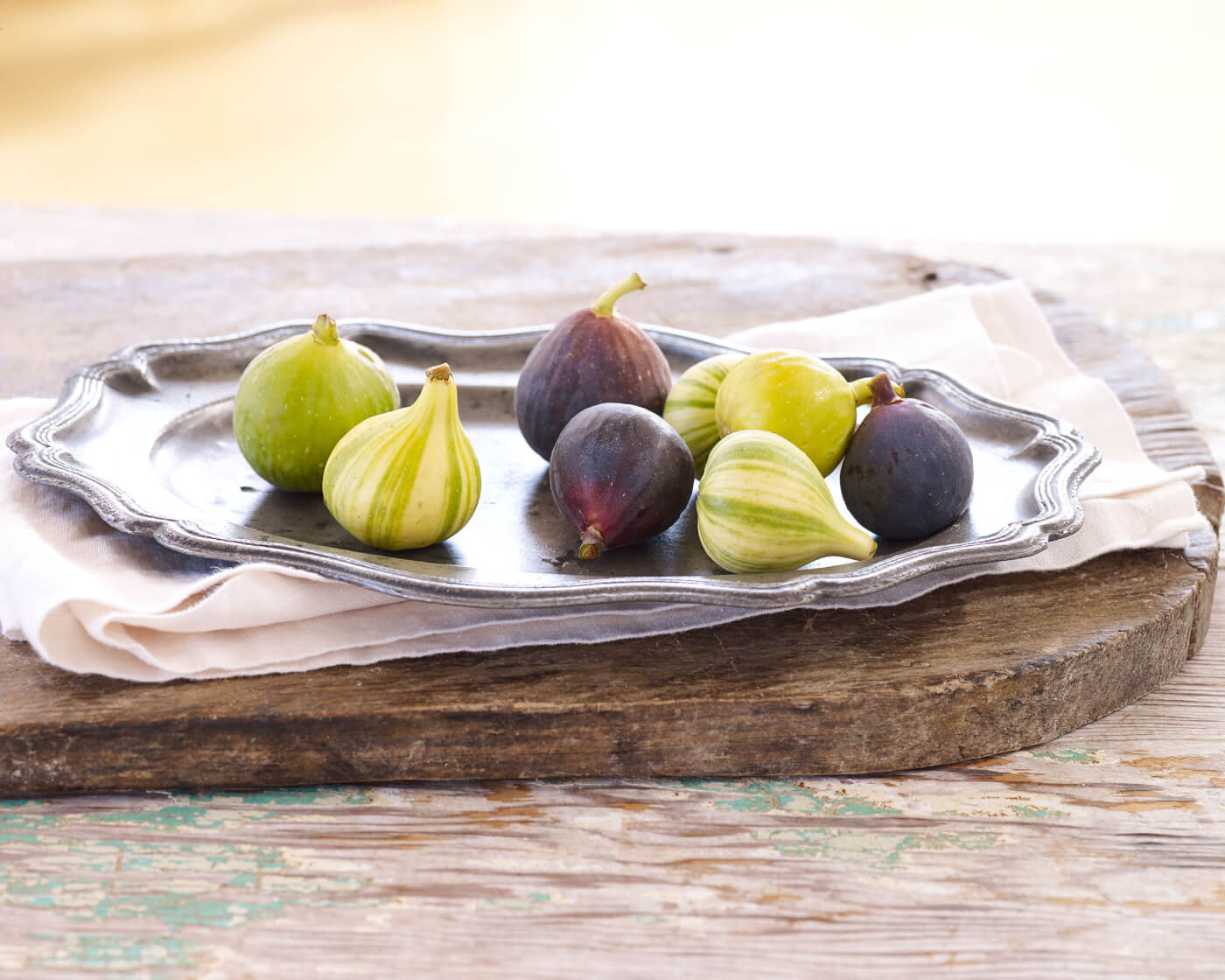 brown and green figs on a serving plate