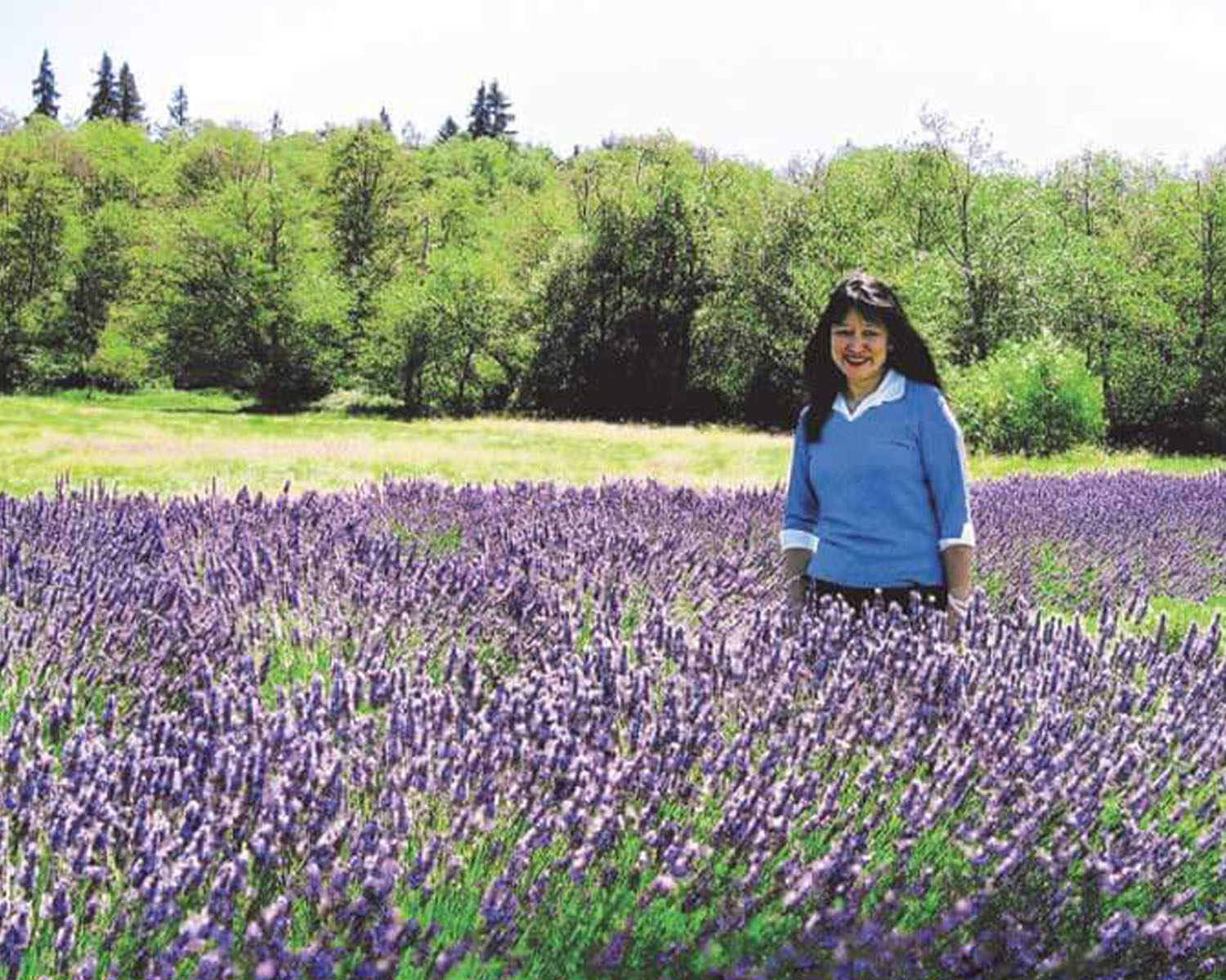 Esther Beltran standing in a field of lavender