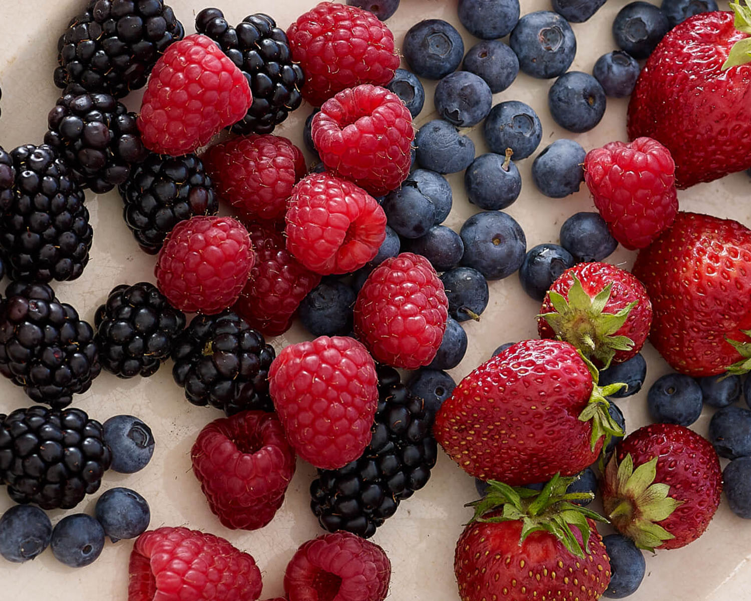 Closeup of blackberries, raspberries, blueberries and strawberries