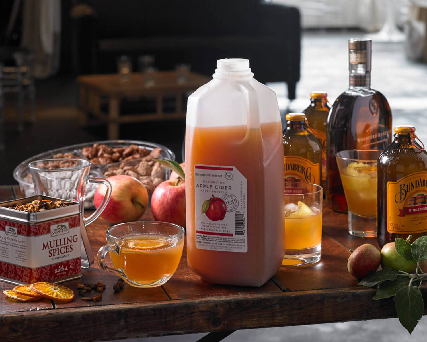 Jug of apple cider on a fall themed table