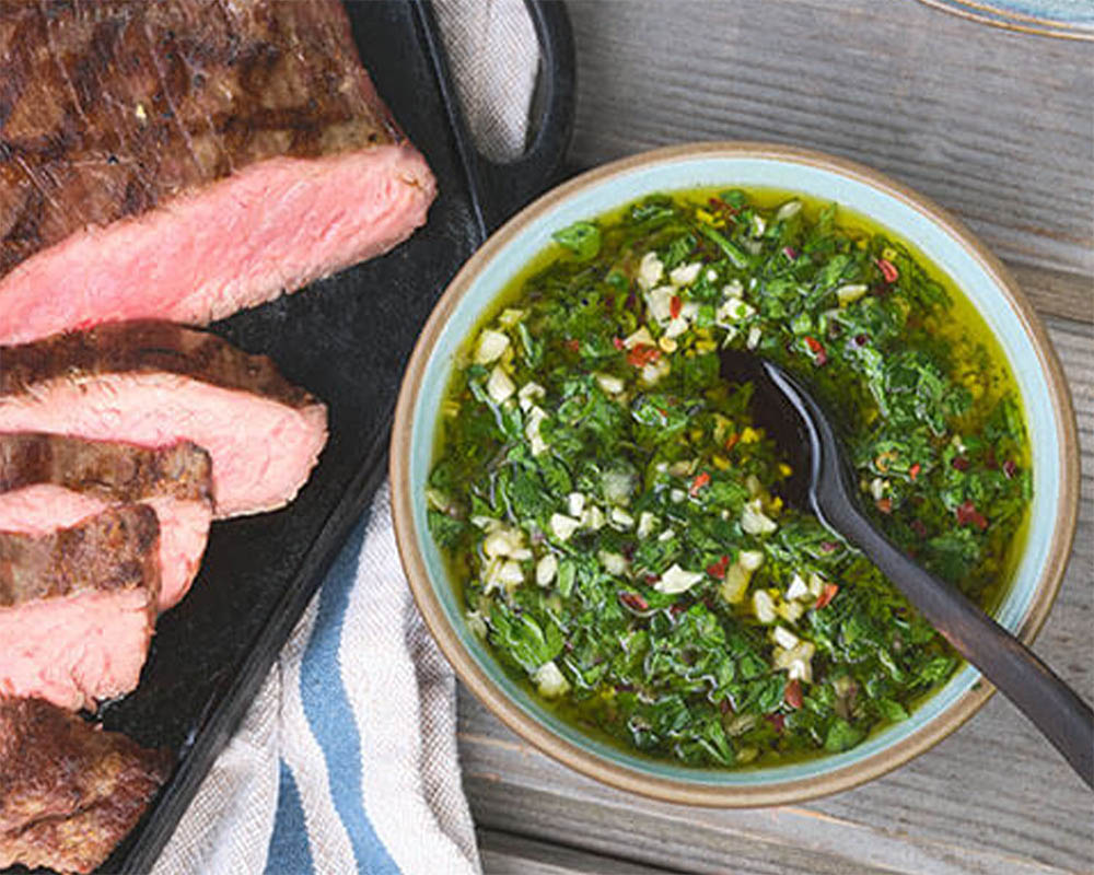 grilled steak with green sauce