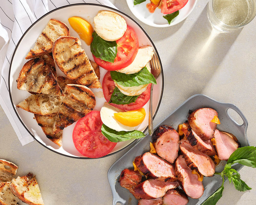 grilled bread, pork caprese salad peaches