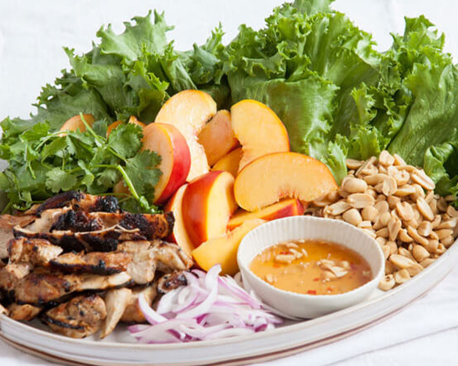 peach chicken lettuce wraps with peanut sauce