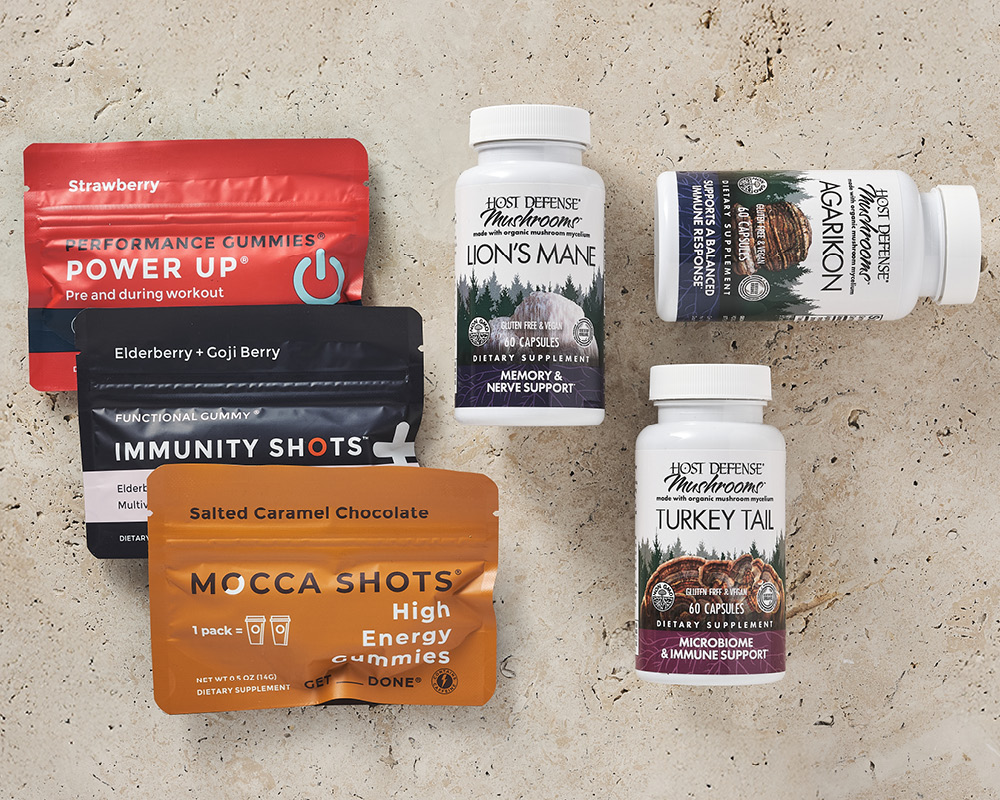 Seattle Gummy Co and Host Defense products on tan background