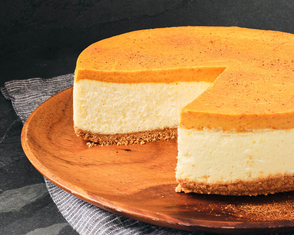 Pumpkin cheesecake with a slice removed