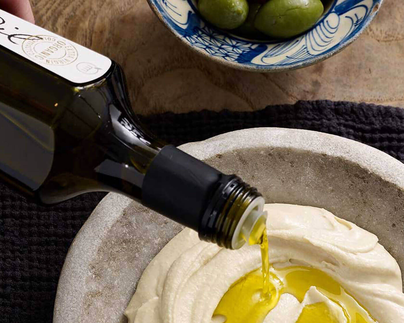 Olive oil drizzled over hummus