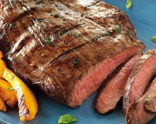 Sliced balsamic marinated steak.