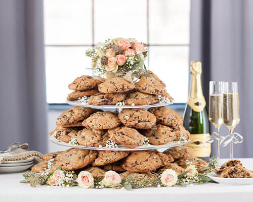 Large cookies stacked in the shape of a three tiered cake