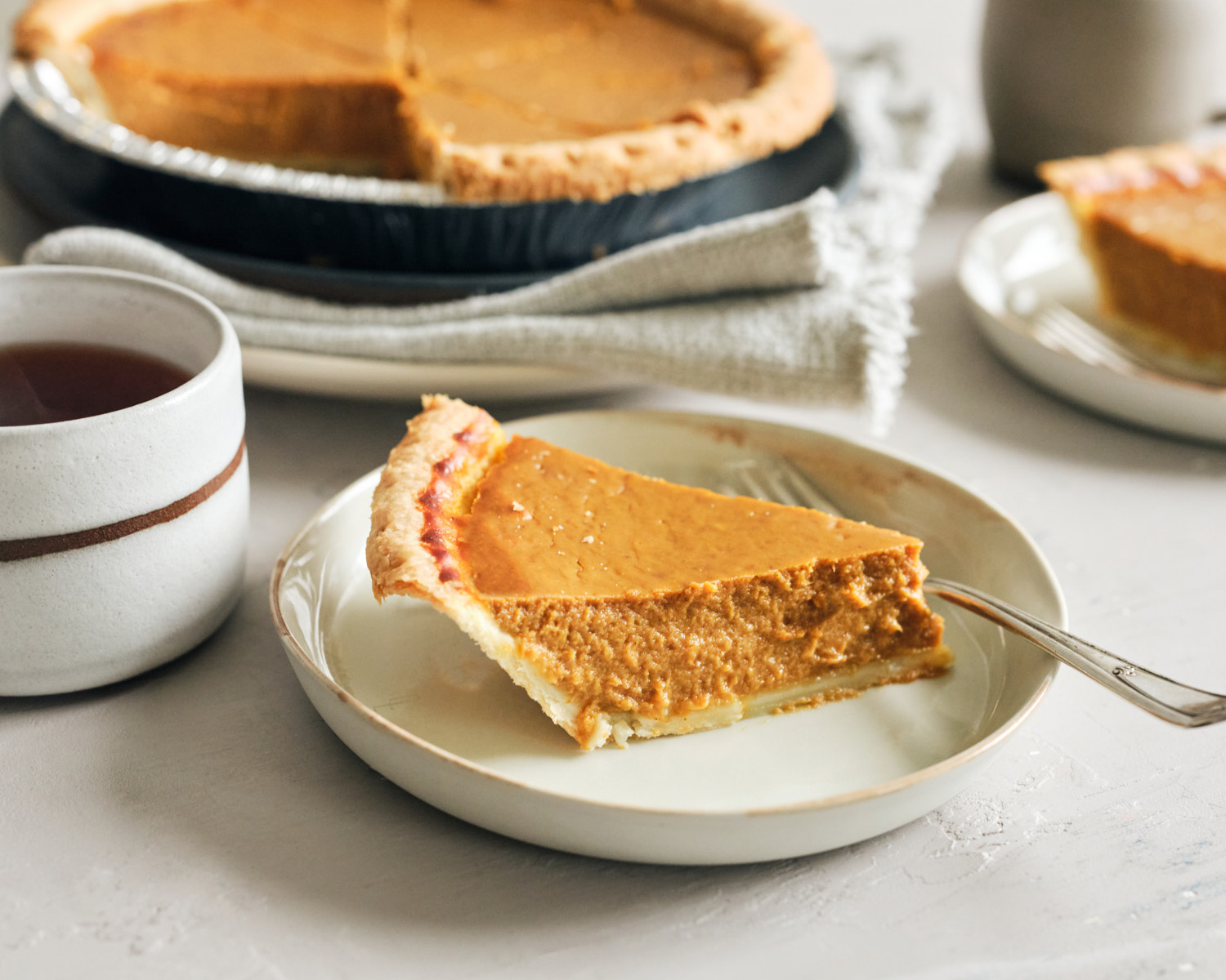 vegan pumpkin pie slice with coffee