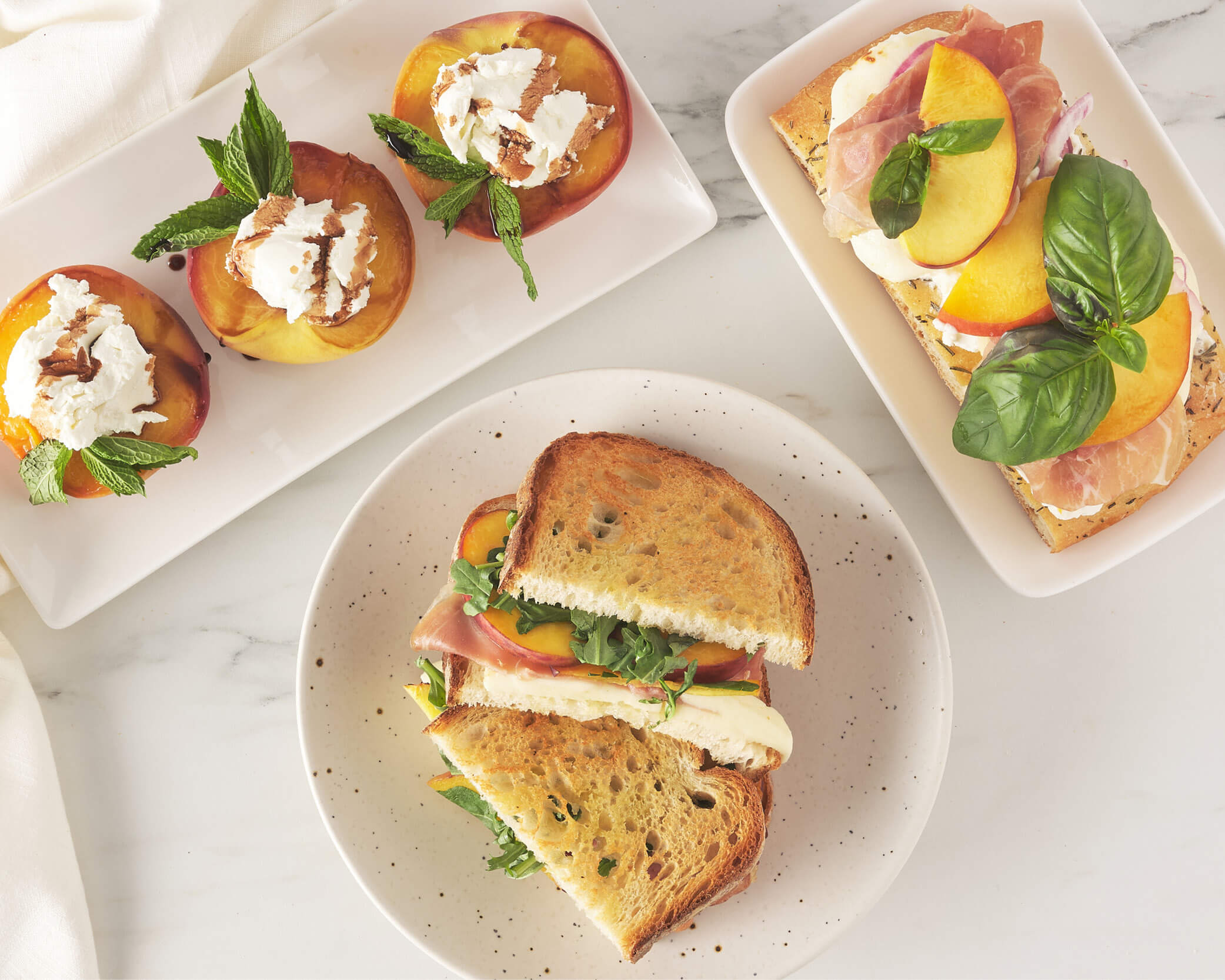 peaches with goat cheese, grilled cheese, and pizza