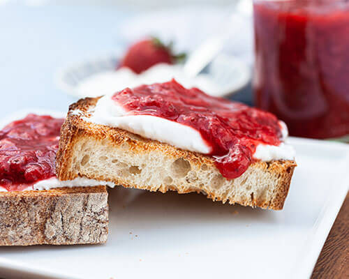 red jam on rustic toast