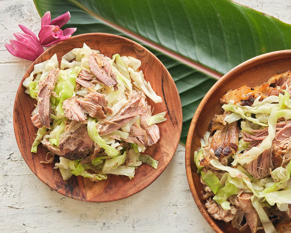 shredded pork and cabbage on wood plates