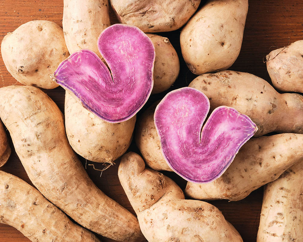 Mound of root vegetables with one heart shaped form on top.