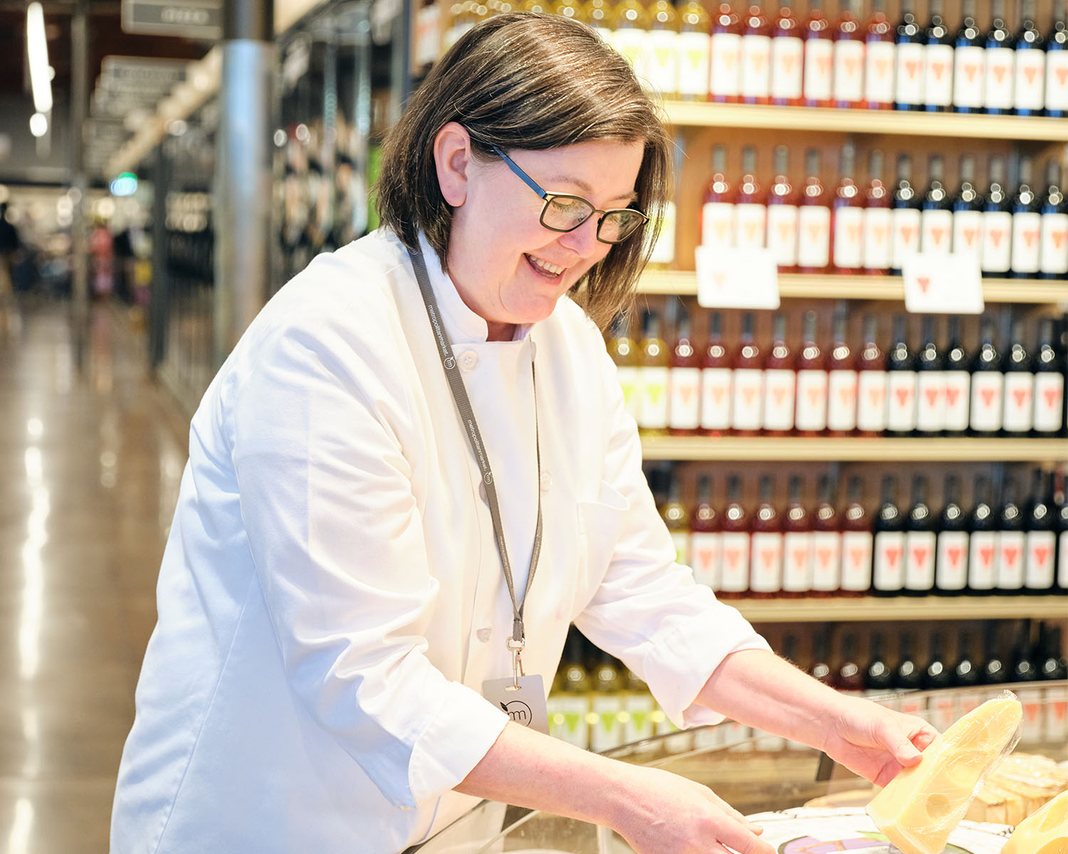 Kim Martin arranging a cheese display