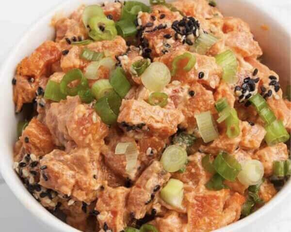 Bowl of sriracha salmon poke.