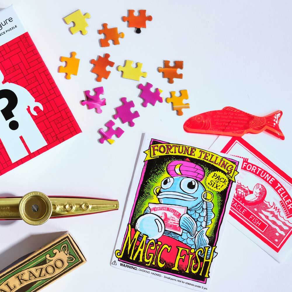 puzzle pieces and fortune teller kit on table