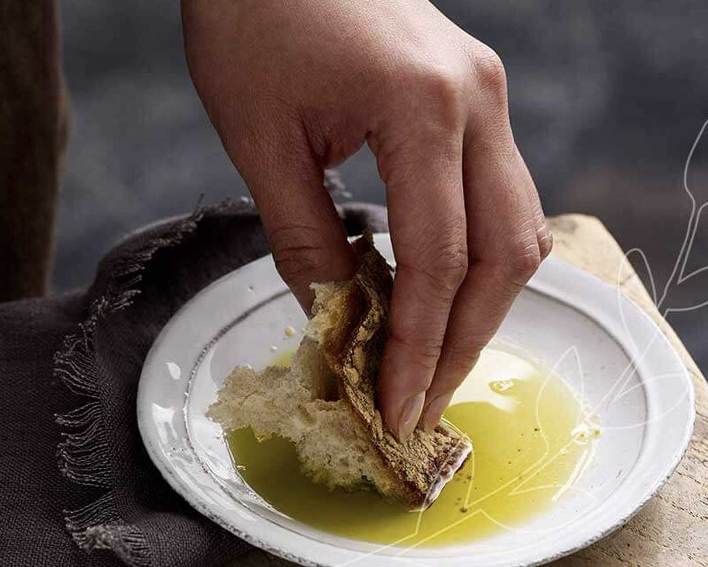 dipping bread in olive oil