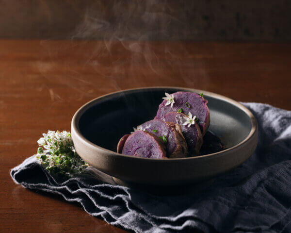 okinawan sweet potato sliced and cooked steaming in a bowl
