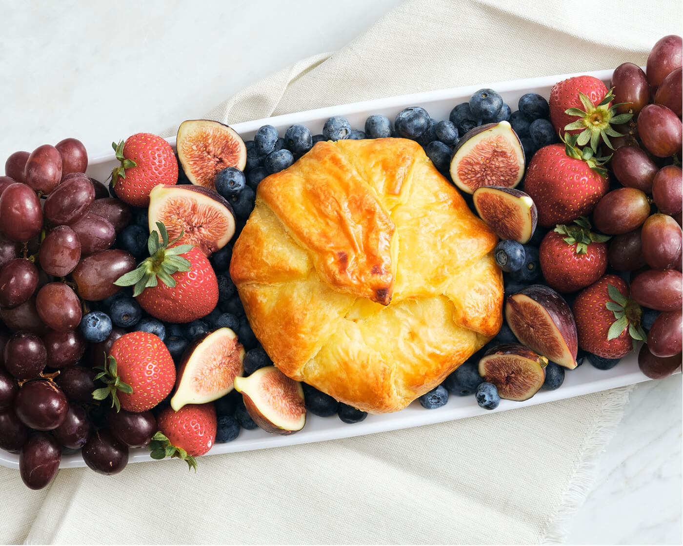 pastry on tray of berries